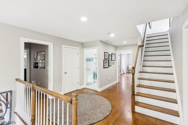 entrance foyer with recessed lighting, baseboards, and wood finished floors