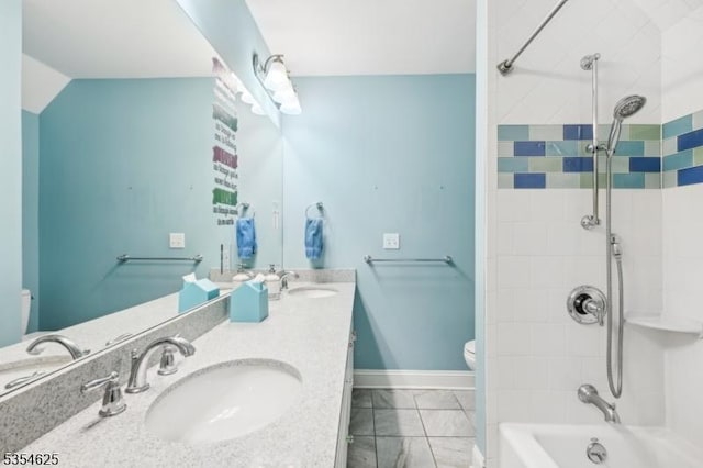 full bathroom with toilet,  shower combination, a sink, and marble finish floor