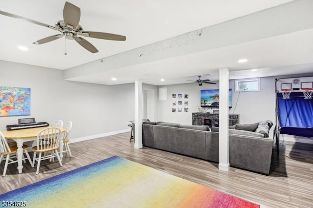 living area featuring ceiling fan, recessed lighting, and wood finished floors