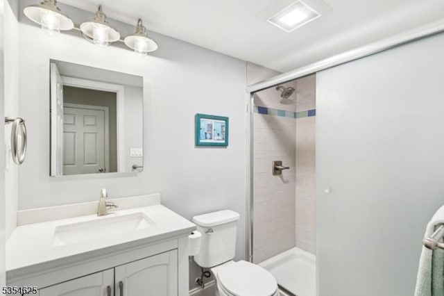 full bath with vanity, toilet, visible vents, and a stall shower