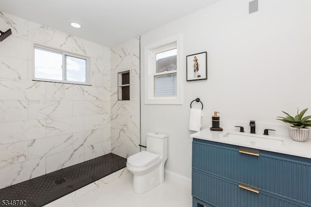 553 Thoreau Ter, Union Twp, NJ 07083 - bathroom with a tile shower, vanity, toilet, marble finish floor, and baseboards