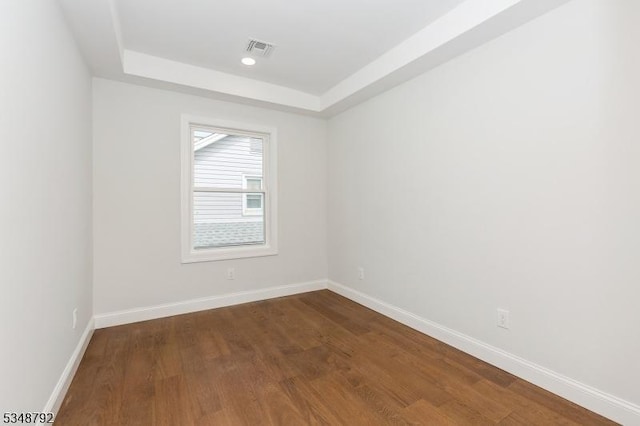 553 Thoreau Ter, Union Twp, NJ 07083 - empty room featuring baseboards, visible vents, dark wood finished floors, and a raised ceiling