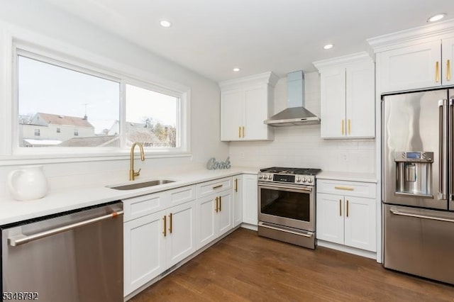 553 Thoreau Ter, Union Twp, NJ 07083 - kitchen with wall chimney range hood, white cabinets, a sink, light countertops, and stainless steel appliances