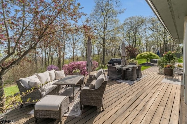 wooden terrace featuring outdoor dining space and an outdoor living space