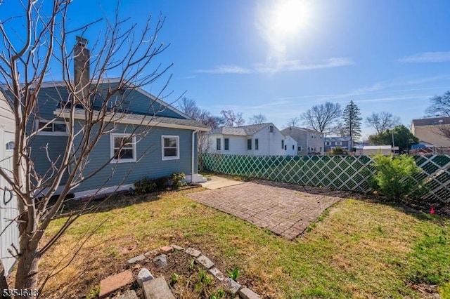 view of yard with a patio and fence