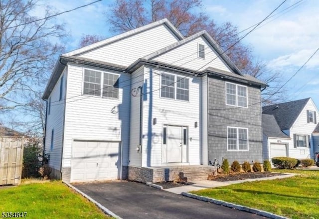 376 Wallingford Ter, Union Twp, NJ 07083 - view of front of house with a garage, driveway, and a front yard