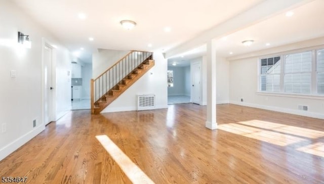 376 Wallingford Ter, Union Twp, NJ 07083 - unfurnished living room featuring stairway, wood finished floors, baseboards, and recessed lighting