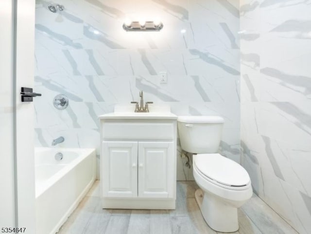 376 Wallingford Ter, Union Twp, NJ 07083 - bathroom with toilet, vanity, tile walls, and bathtub / shower combination