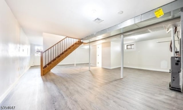 376 Wallingford Ter, Union Twp, NJ 07083 - basement featuring wood finished floors, stairs, healthy amount of natural light, and baseboards