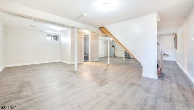 376 Wallingford Ter, Union Twp, NJ 07083 - basement with wood finished floors, baseboards, water heater, and stairway