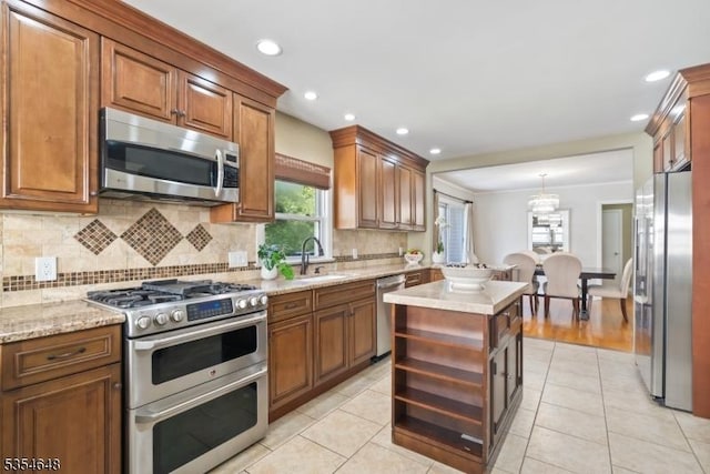 kitchen with a sink, open shelves, tasteful backsplash, and stainless steel appliances