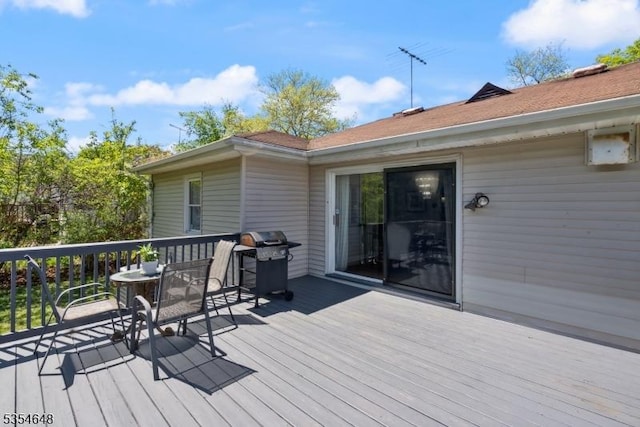 wooden deck with grilling area