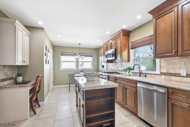 kitchen featuring recessed lighting, a sink, tasteful backsplash, and stainless steel appliances
