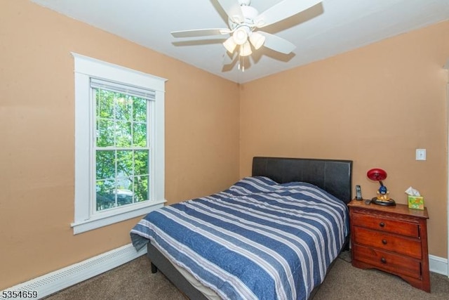 carpeted bedroom with a ceiling fan, baseboards, and a baseboard radiator