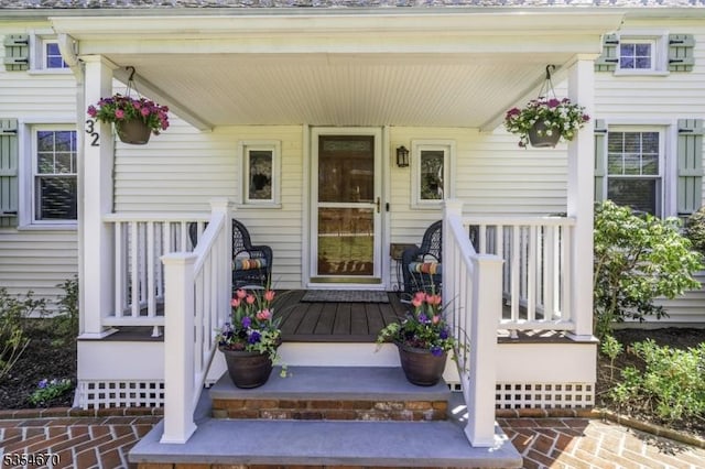 doorway to property featuring covered porch