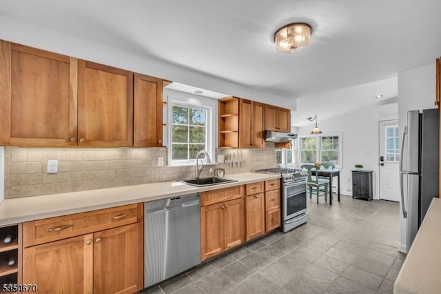 kitchen with open shelves, appliances with stainless steel finishes, a sink, light countertops, and under cabinet range hood