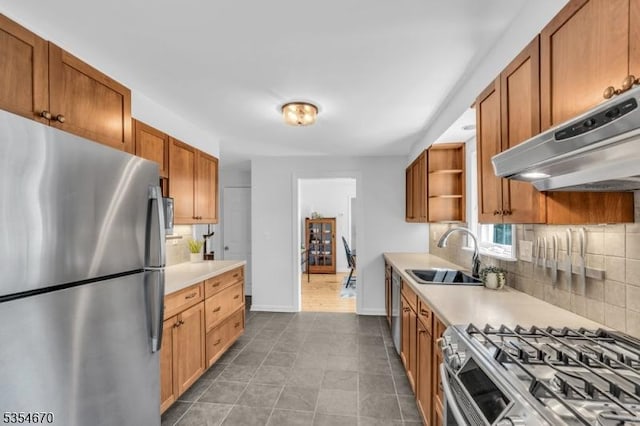 kitchen featuring decorative backsplash, open shelves, a sink, under cabinet range hood, and stainless steel appliances