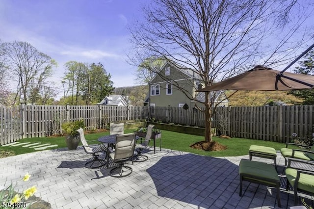view of patio / terrace featuring a fenced backyard and outdoor dining space