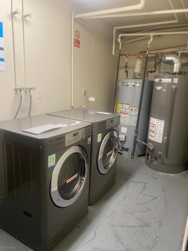 laundry room featuring laundry area, gas water heater, and washer and dryer