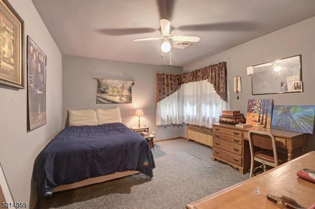 carpeted bedroom featuring a ceiling fan, baseboards, visible vents, and radiator