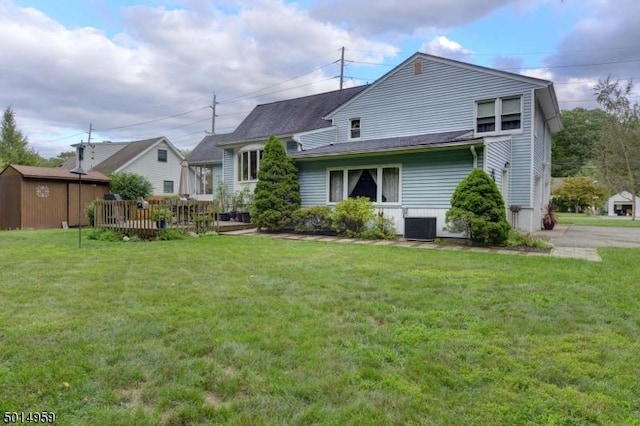 back of house with a yard