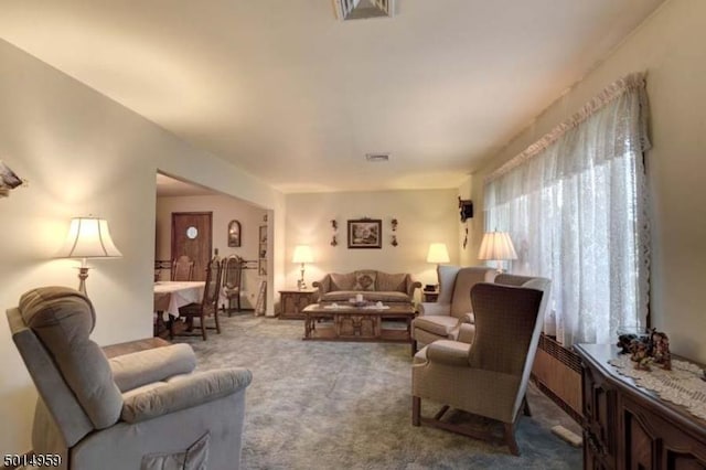 carpeted living room featuring visible vents