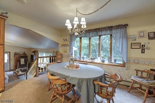 dining room featuring carpet floors, a chandelier, and a wealth of natural light