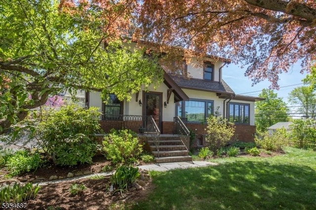 1 Ambar Pl, Bernardsville Boro, NJ 07924 - obstructed view of property featuring stucco siding, brick siding, and a front yard