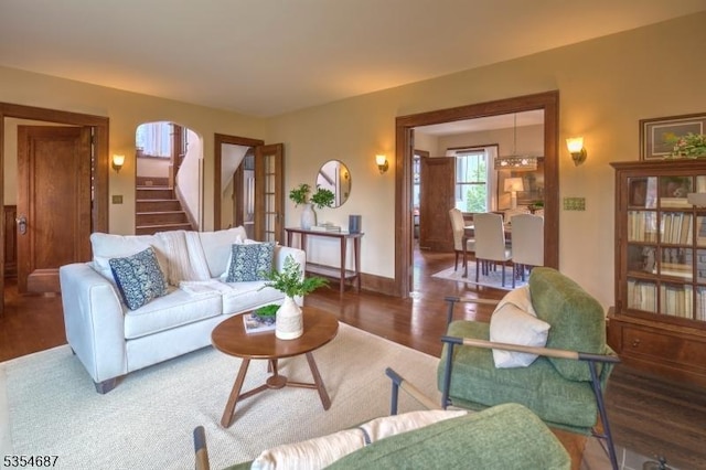 1 Ambar Pl, Bernardsville Boro, NJ 07924 - living area featuring wood finished floors, stairs, baseboards, and arched walkways