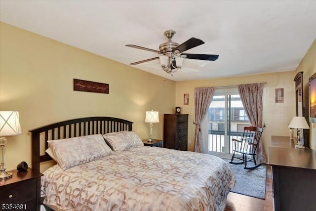 bedroom featuring access to outside, ceiling fan, and wood finished floors