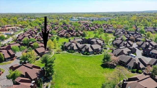 birds eye view of property with a residential view