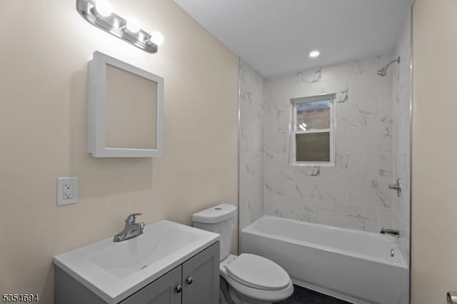 bathroom with toilet, vanity, and washtub / shower combination