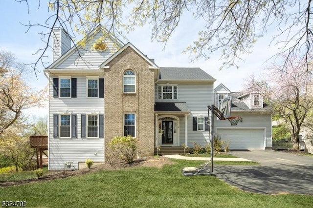 view of front of home featuring concrete driveway, a chimney, and a front lawn
