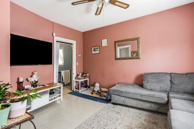 living area featuring a ceiling fan and light flooring