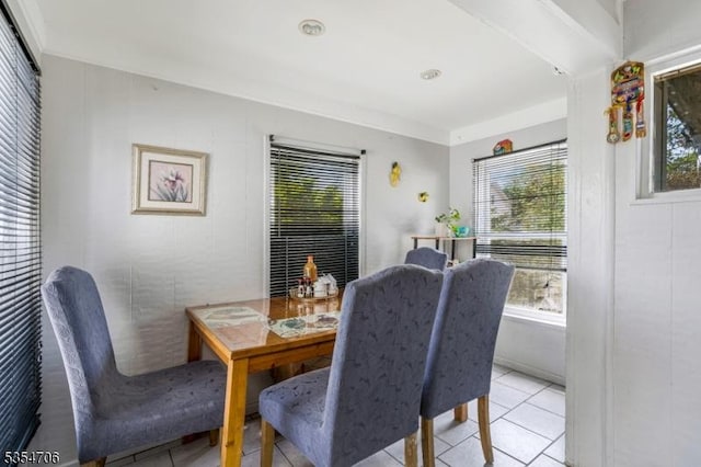 dining space featuring light tile patterned floors