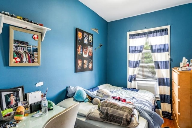bedroom with wood finished floors