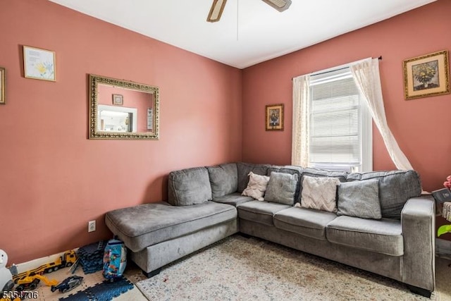 living area featuring ceiling fan