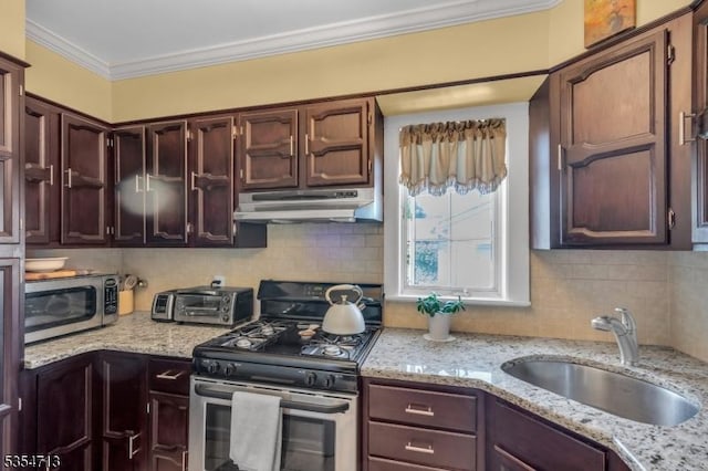 kitchen with crown molding, a sink, stainless steel appliances, a toaster, and under cabinet range hood