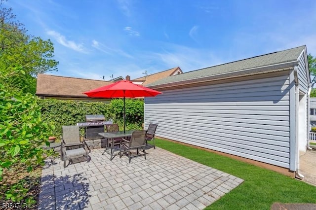 view of patio / terrace with area for grilling and outdoor dining area