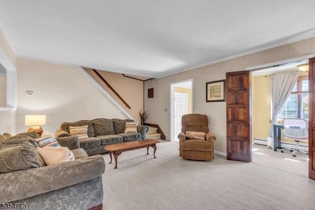 carpeted living area featuring crown molding, a baseboard radiator, and stairway