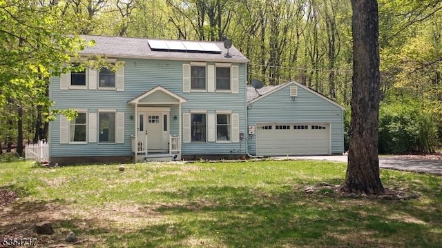 57 Quenby Mountain Rd, Liberty Twp, NJ 07838 - colonial house featuring an attached garage, roof mounted solar panels, driveway, and a front yard