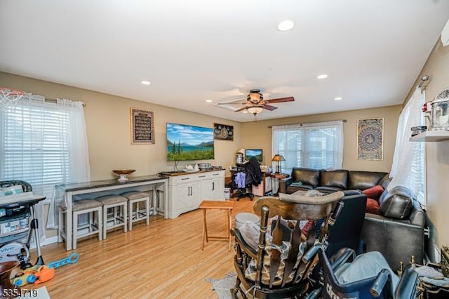 living room with recessed lighting, ceiling fan, and light wood-style floors