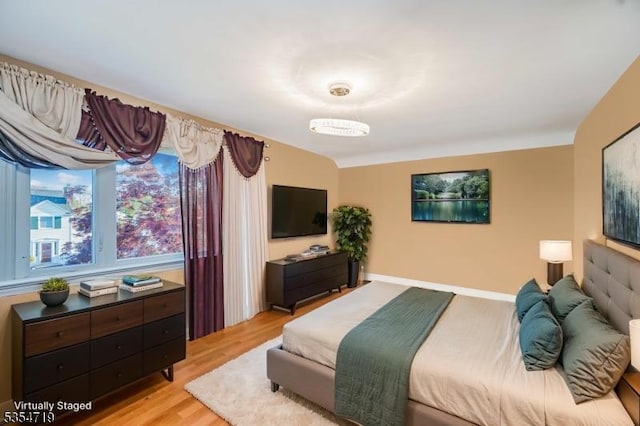 bedroom featuring light wood-style floors