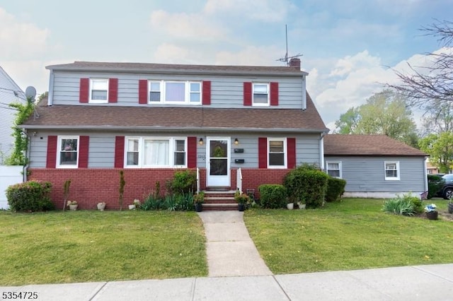 1263 Biscayne Blvd, Union Twp, NJ 07083 - view of front of property with brick siding, a chimney, and a front yard