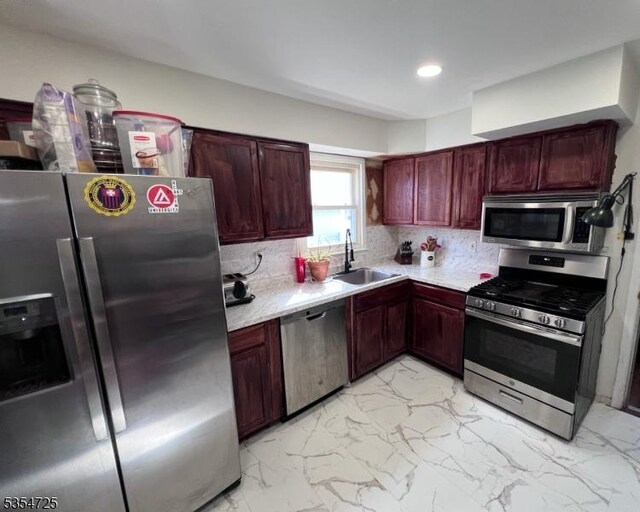 1263 Biscayne Blvd, Union Twp, NJ 07083 - kitchen with dark brown cabinets, light countertops, appliances with stainless steel finishes, and a sink
