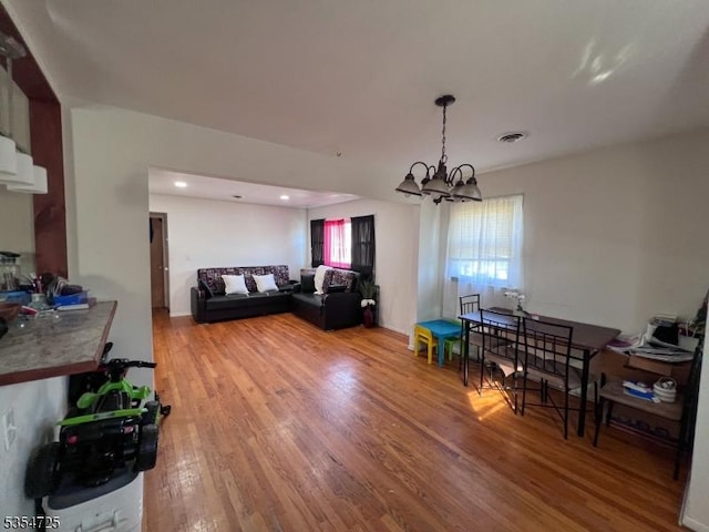 1263 Biscayne Blvd, Union Twp, NJ 07083 - living area with an inviting chandelier, light wood-style floors, a healthy amount of sunlight, and recessed lighting