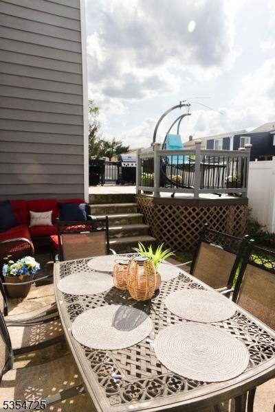 1263 Biscayne Blvd, Union Twp, NJ 07083 - view of wooden balcony with a deck and outdoor dining area