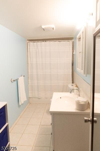 1263 Biscayne Blvd, Union Twp, NJ 07083 - full bathroom featuring tile patterned flooring, vanity, and a shower with shower curtain