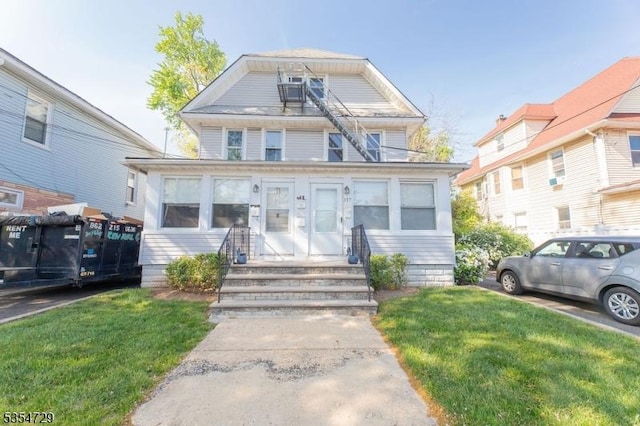 157-159 Virginia St, Hillside Twp, NJ 07205 - view of front of house with a front yard and entry steps