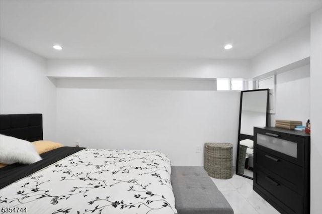 bedroom featuring recessed lighting and marble finish floor